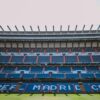 Empty stands of Santiago Bernabéu Stadium in Madrid, showcasing Real Madrid CF's seats.