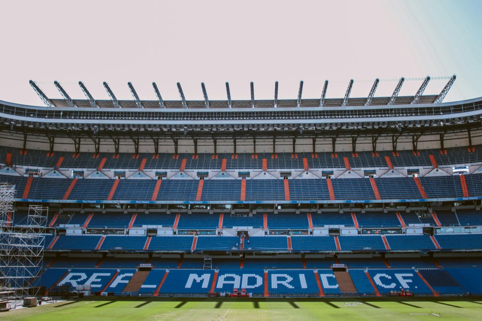 Empty stands of Santiago Bernabéu Stadium in Madrid, showcasing Real Madrid CF's seats.