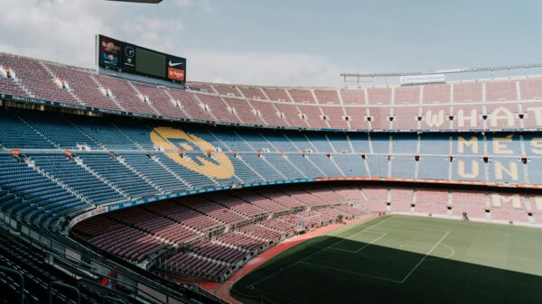 View of Camp Nou stadium in Barcelona, showcasing the iconic stands and field.
