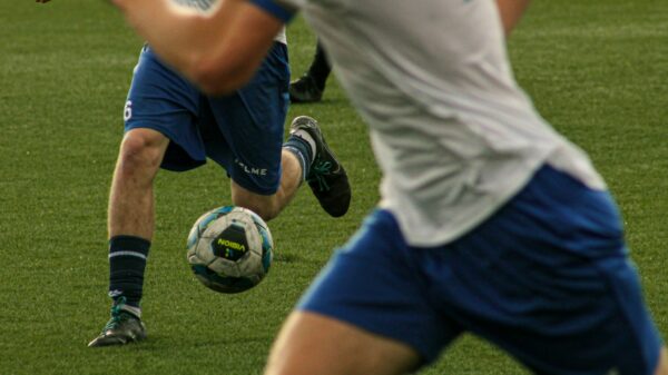 Soccer players are shown during a match.