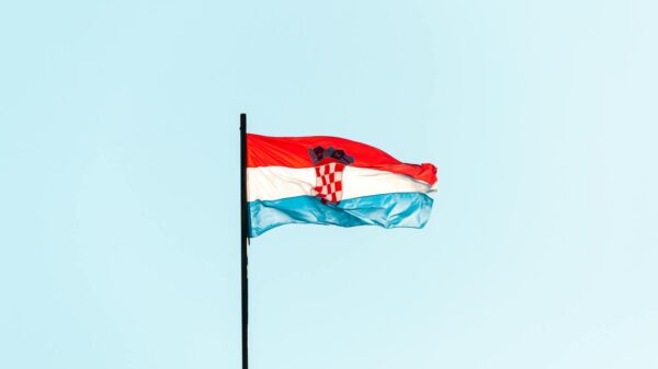 The national flag of Croatia waving against a blue sky in Trogir.