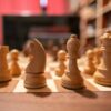 Close-up of wooden chess pieces on a chessboard in a cozy indoor setting.