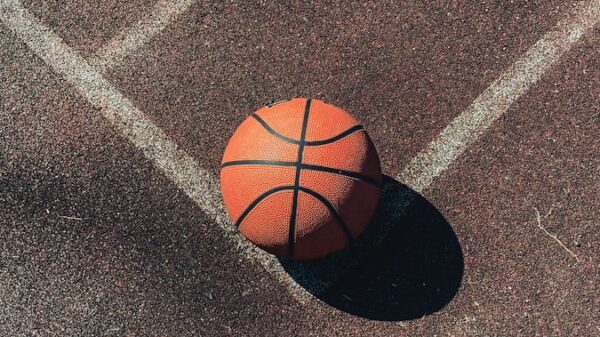 brown basketball on gray concrete floor