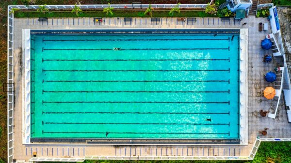 Drone shot of a vibrant swimming pool in Jawa Barat, Indonesia, showing clear turquoise water.