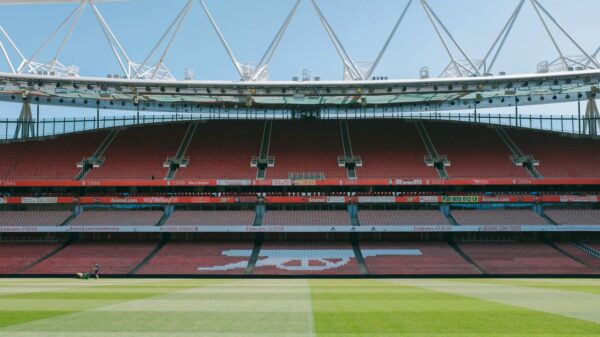 A view of the empty stands and football pitch at Emirates Stadium, London, England.