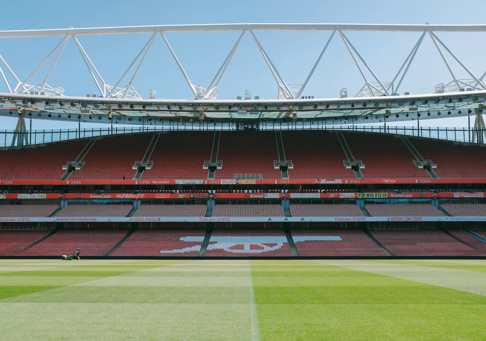 A view of the empty stands and football pitch at Emirates Stadium, London, England.