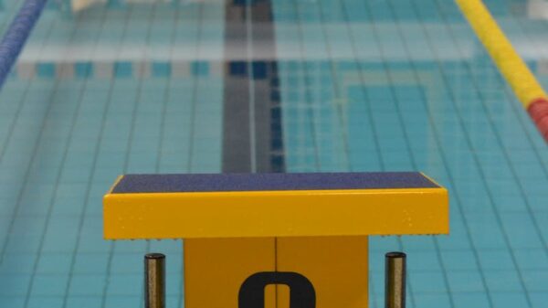 Indoor swimming pool with starting block number six, perfect for pool sports and training.