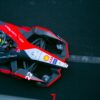 A dynamic top view of a Formula E car racing on a track in Ciudad de México.