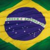 Close-up of the Brazilian flag featuring 'Ordem e Progresso' text and symbolic elements.