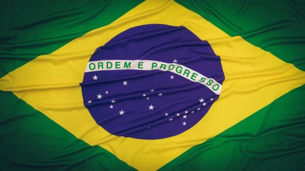 Close-up of the Brazilian flag featuring 'Ordem e Progresso' text and symbolic elements.