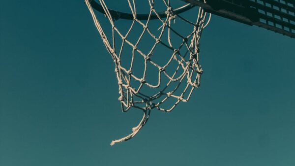 A basketball nearing the hoop on an outdoor court in London.