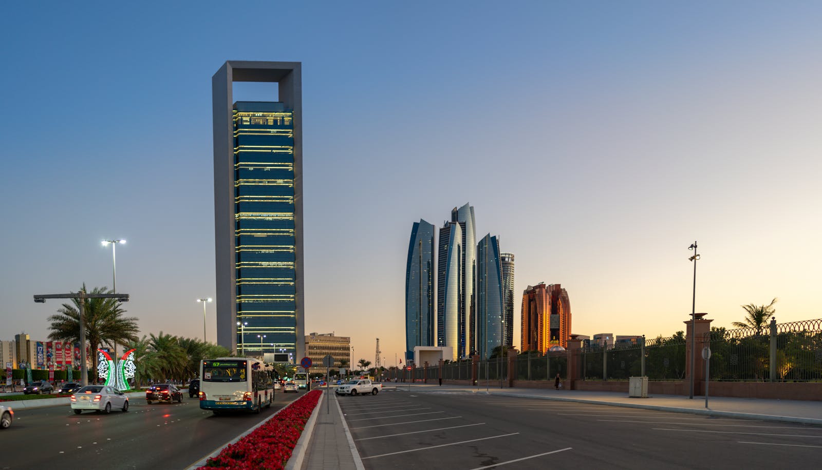 Stunning view of Abu Dhabi's skyline with skyscrapers and traffic at sunset.