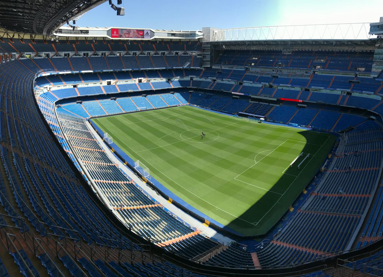 High-angle view of the empty Santiago Bernabeu Stadium on a sunny day in Madrid, Spain.