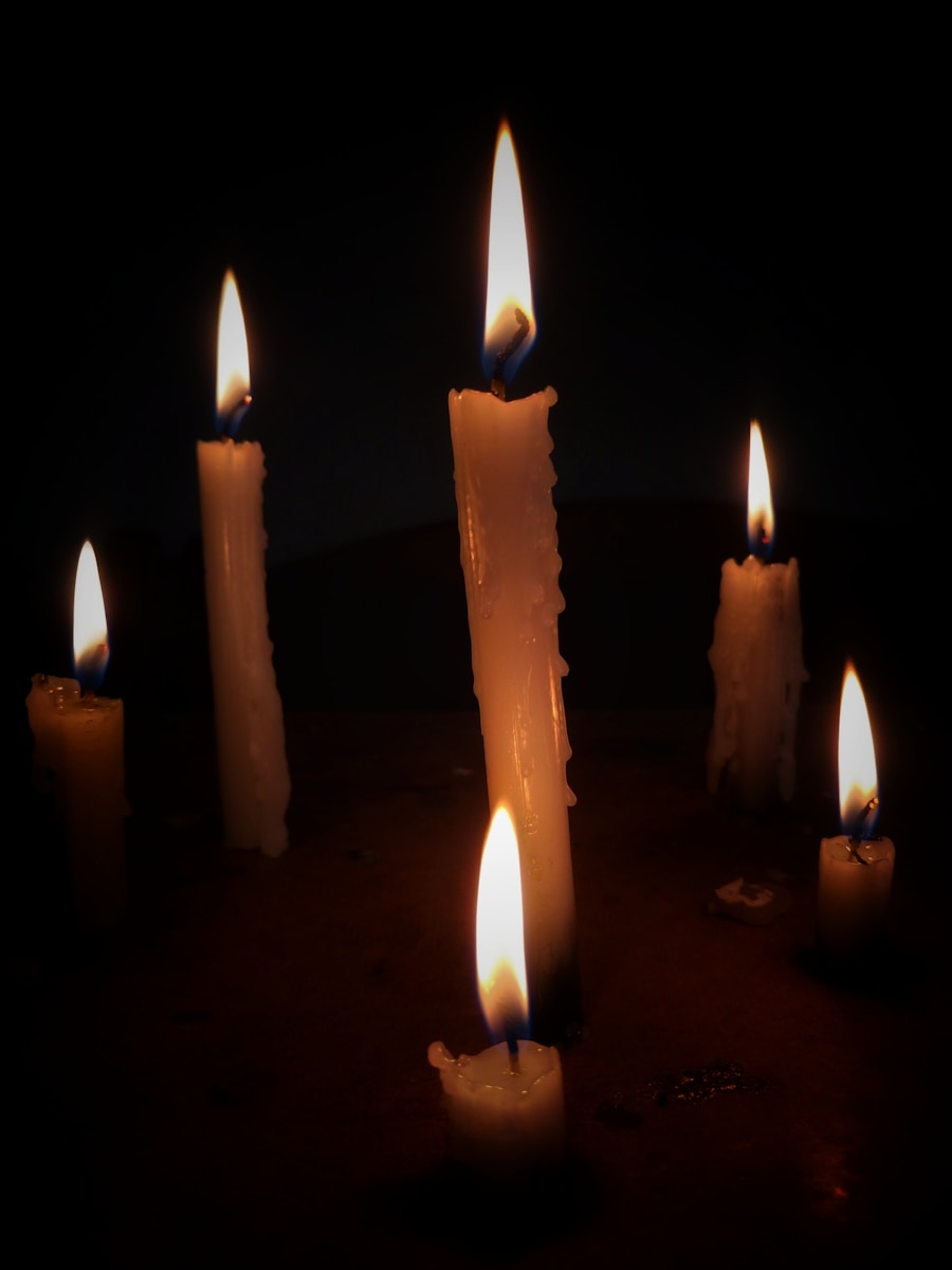 a group of lit candles sitting on top of a table