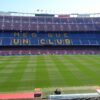 Panoramic view of Camp Nou stadium in Barcelona, home of FC Barcelona football team, with 'Mes Que Un Club' slogan.
