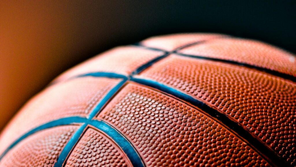 brown and black basketball ball