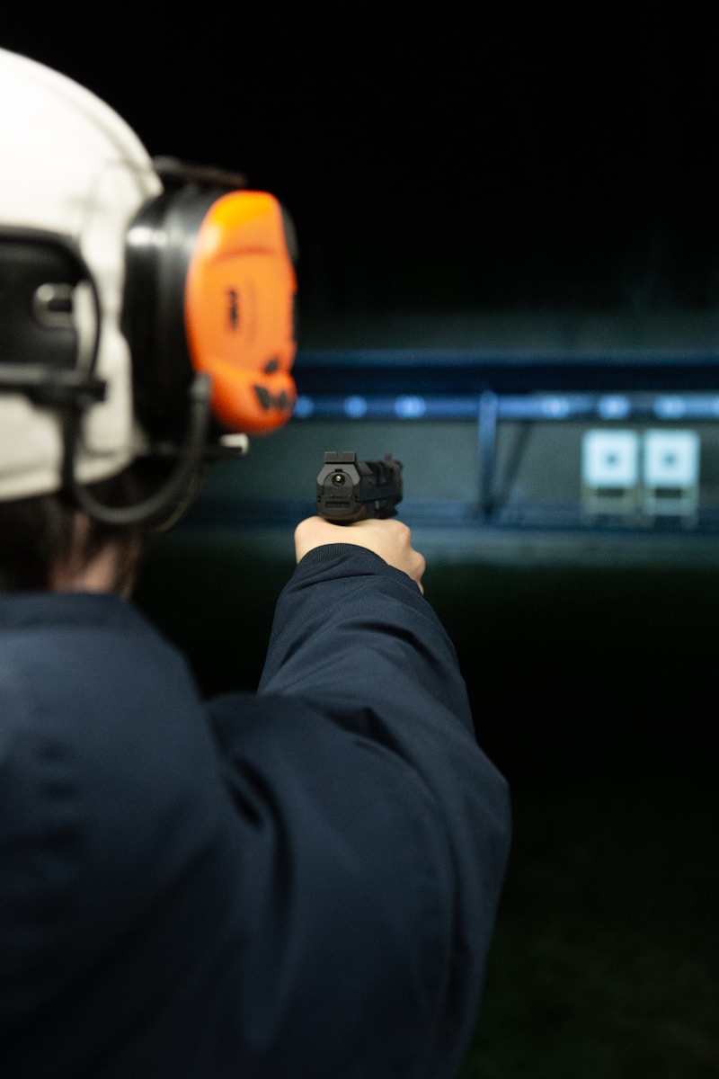 A man pointing a gun at the camera