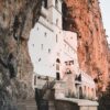 Stunning view of Ostrog Monastery built into the cliffside in Montenegro.