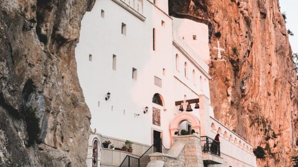 Stunning view of Ostrog Monastery built into the cliffside in Montenegro.