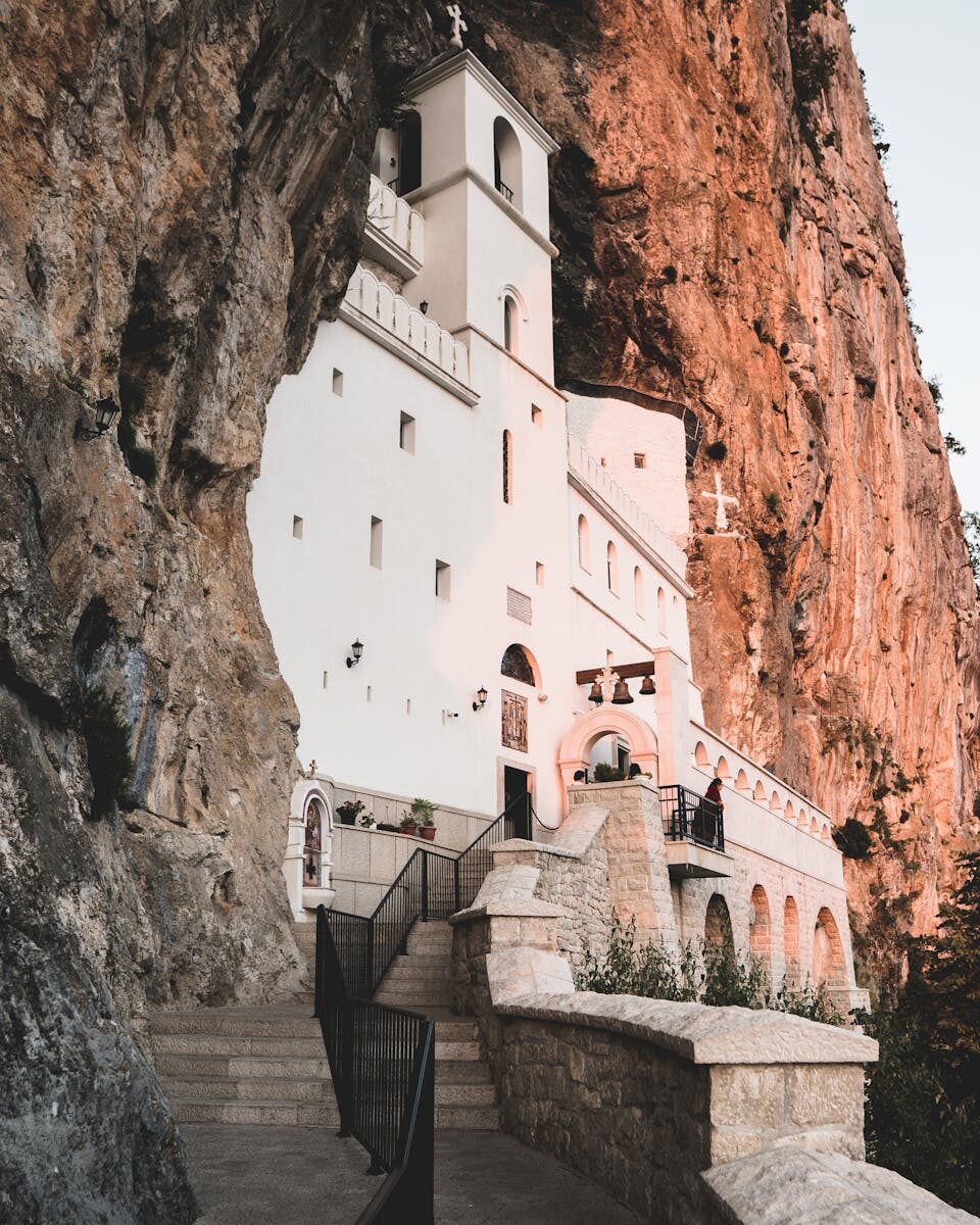 Stunning view of Ostrog Monastery built into the cliffside in Montenegro.