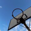 Basketball hoop silhouetted against a clear sky with the moon visible in Antalya, Türkiye.