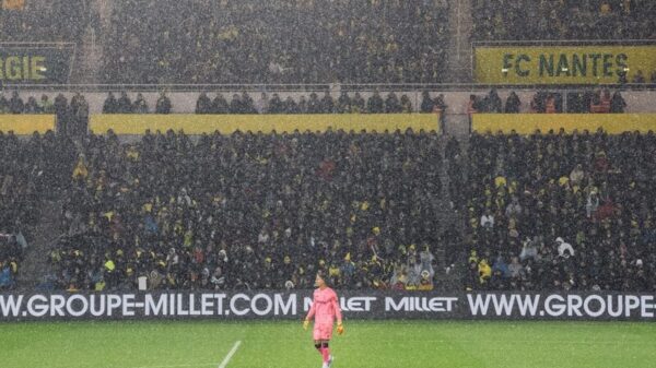 soccer players on field during daytime