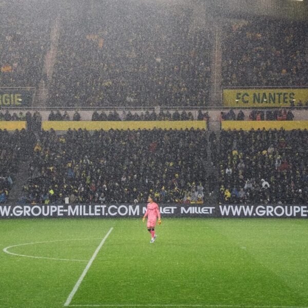 soccer players on field during daytime