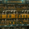 Vibrant atmosphere inside La Bombonera stadium, showcasing enthusiastic soccer fans and iconic banners.