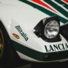 Detailed view of a Lancia Stratos sports car with Alitalia branding, showcasing its classic rally design.