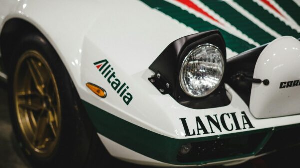 Detailed view of a Lancia Stratos sports car with Alitalia branding, showcasing its classic rally design.