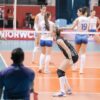 Volleyball players on court during a match