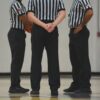 A group of men standing on top of a basketball court
