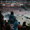 crowd of people watching sports inside arena