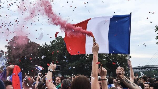woman holding red smoke can