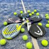 tennis rackets and balls on a tennis court
