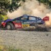 Exciting rally car racing through dust on a gravel road in Pavliani, Greece.