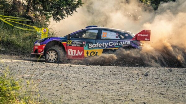 Exciting rally car racing through dust on a gravel road in Pavliani, Greece.