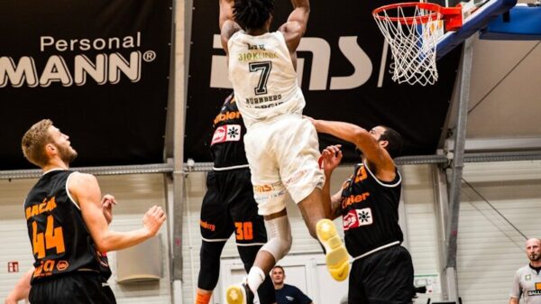 people playing basketball inside court