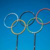 Olympic rings sculpture set against a clear blue sky in Lahti, Finland.
