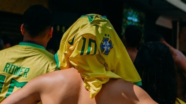 a group of people in yellow shirts standing next to each other