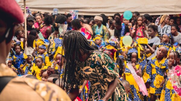 a group of people standing around each other