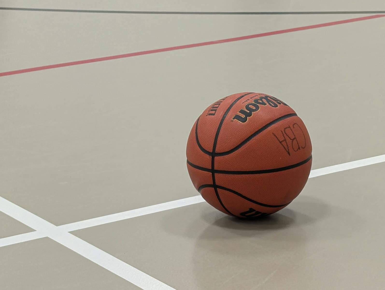 Close-up of a basketball resting on an indoor court in Nova Scotia.