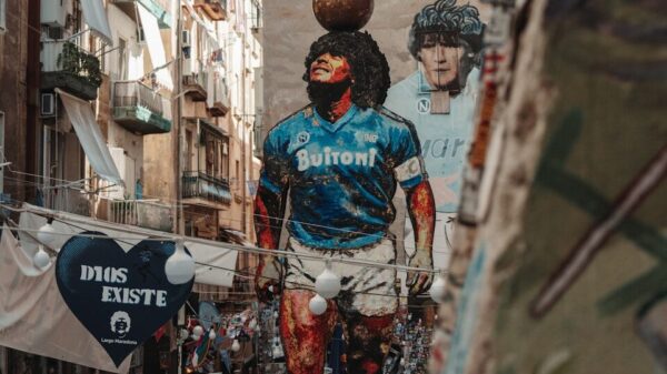 Giant mural of diego maradona in a narrow street