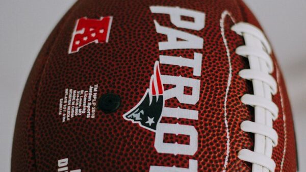 red and white football on white surface