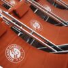 Rows of roland garros chairs are shown.
