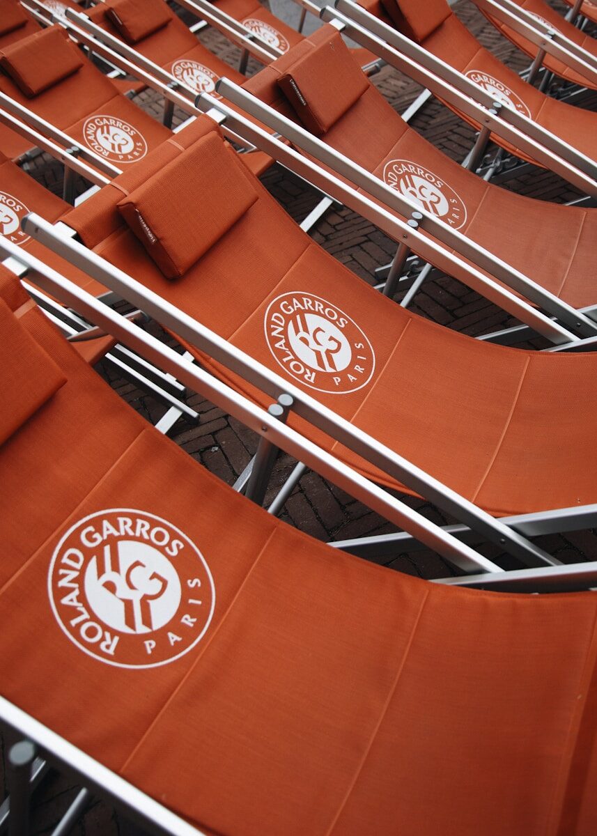 Rows of roland garros chairs are shown.