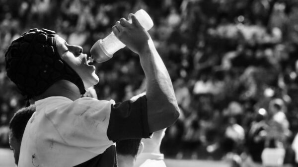 a person drinking from a bottle