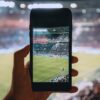 person taking photo using black smartphone