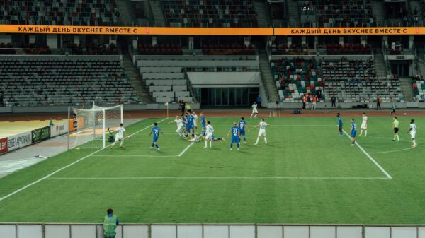 Exciting soccer match captured during day at a modern stadium.