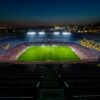 stadium with lights turned on during night time